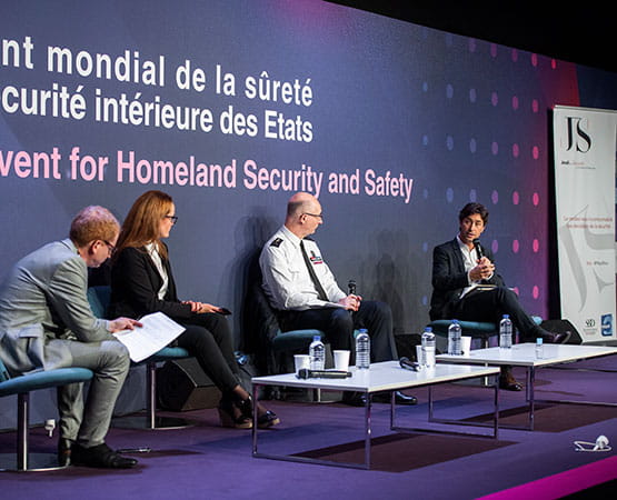 a man speaks at "les jeudis de la sécurité" round-table discussion