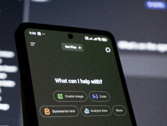 Smartphone screen displaying an AI assistant interface in a dark, tech-focused environment