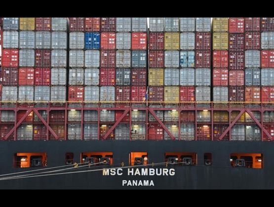 View of a wall of containers on a boat