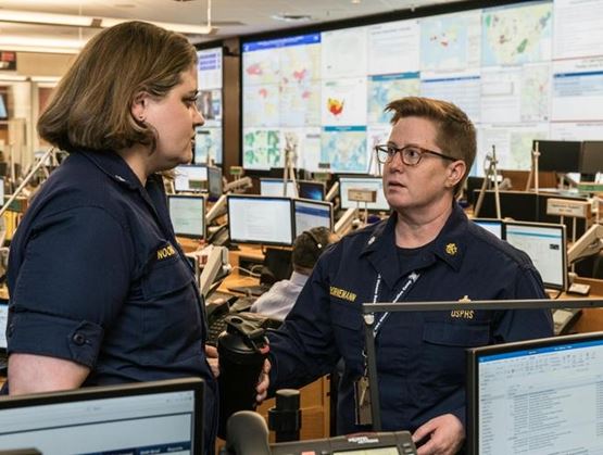 Emergency operations centre with public safety professionals coordinating responses using real-time data and monitoring systems