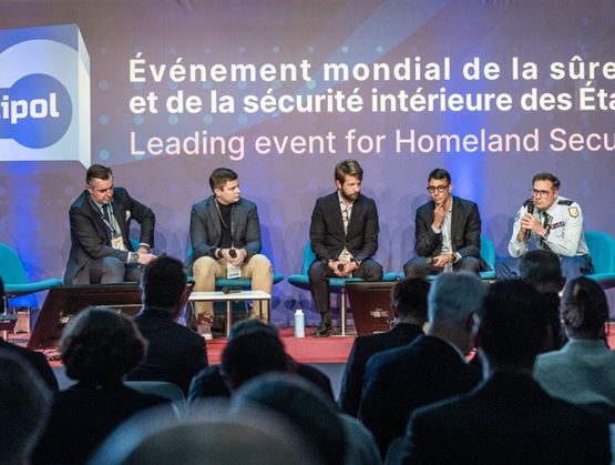 Conference session on artificial intelligence governance at milipol paris 2025 with speakers on stage