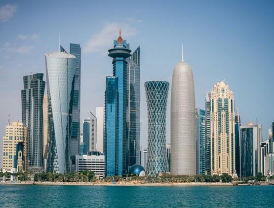 Modern skyline of Doha, Qatar, viewed from across the waterfront.