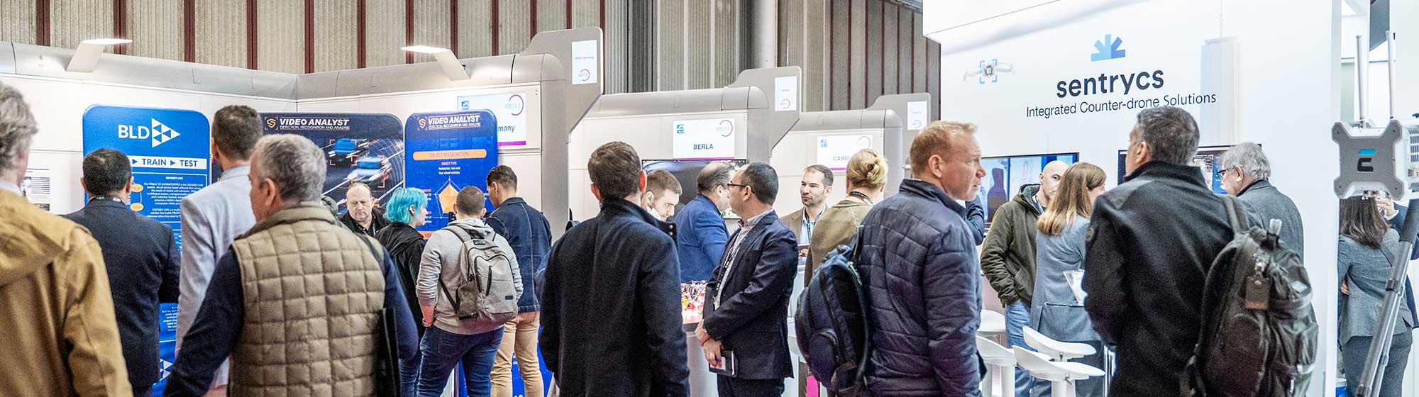 Visitors walking and stopping off at the stands in the Discovery Village