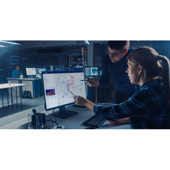 View of Cellebrite solutions with two persons in front of a computer