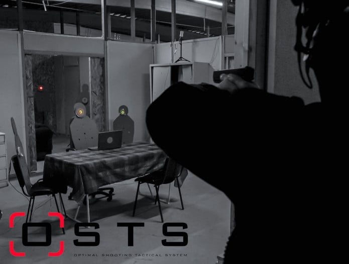 Shooting training simulation with an armed military coming in a room