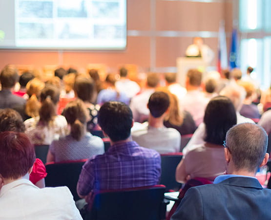 Attendees assisting to a conference